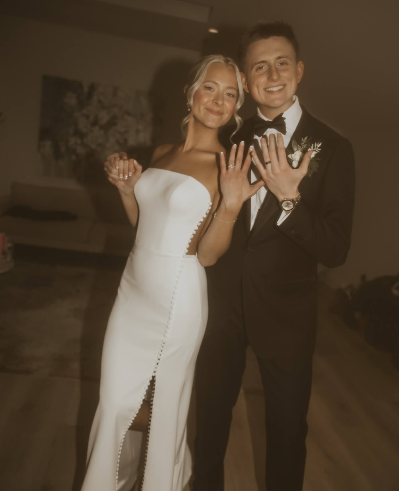 Сouple wearing a white gown and a black suit